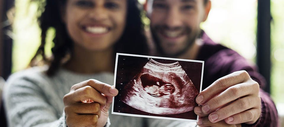 Happy couple with pregnancy news